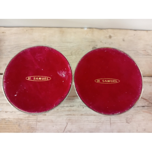 12 - A pair of H.Samuel candle sticks. (H 24cm)