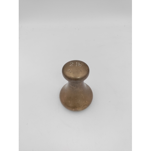 56 - Vintage Cast iron recipe book stand, plus a 2lb brass bell weight