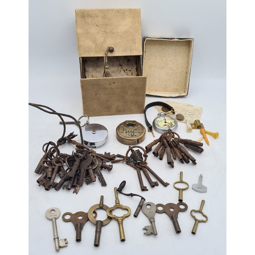 A collection of old keys to include clock keys, box keys, a lock and a ...