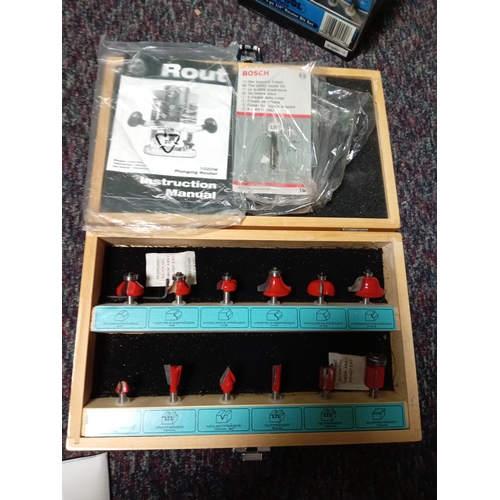 5 - A pair of plunge routers. To include a bosch, a performance power, instructions, router bits, etc...