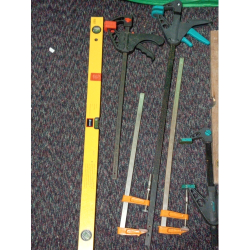 22 - A collection of tools. To include spirit levels, various clips, tool bag, chisels etc...