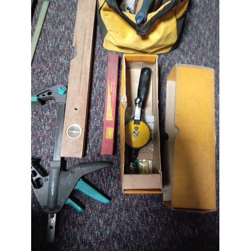 22 - A collection of tools. To include spirit levels, various clips, tool bag, chisels etc...
