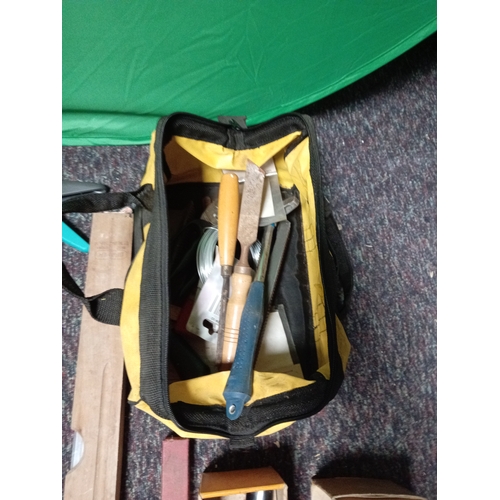 22 - A collection of tools. To include spirit levels, various clips, tool bag, chisels etc...
