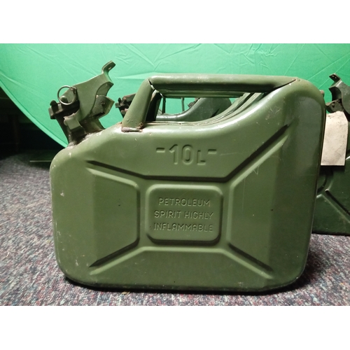 26 - A collection of vintage metal Jerry cans. To include 4 5 litre cans & 1 10 litre can.
