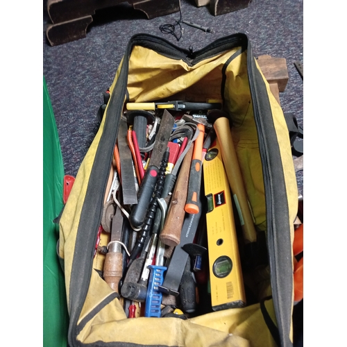 38 - A tool bag full of various tools. To include hammers, plane, screw drivers, chisels, Spirit level, e... 