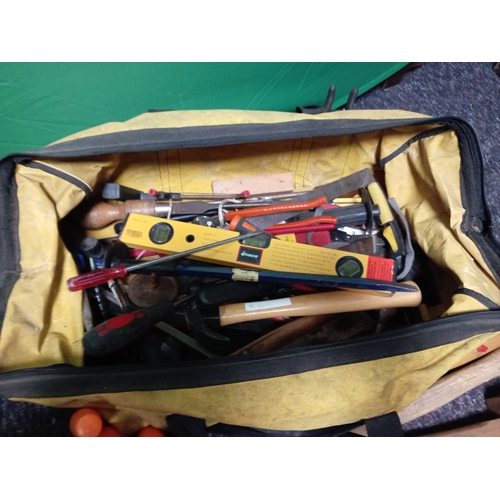 38 - A tool bag full of various tools. To include hammers, plane, screw drivers, chisels, Spirit level, e... 