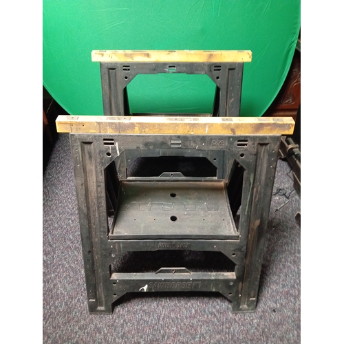 41 - A pair of plastic saw horses. (H 77 cm x W 52 cm x D 69 cm)