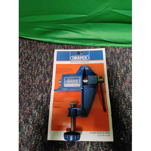 64 - A draper hobby bench vices, a miniature anvil & a vintage Parry & Bott bench vice.