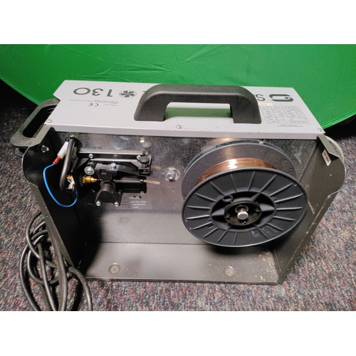 65 - a SIP Migmate 130 welder. To include welding mask & equipment.