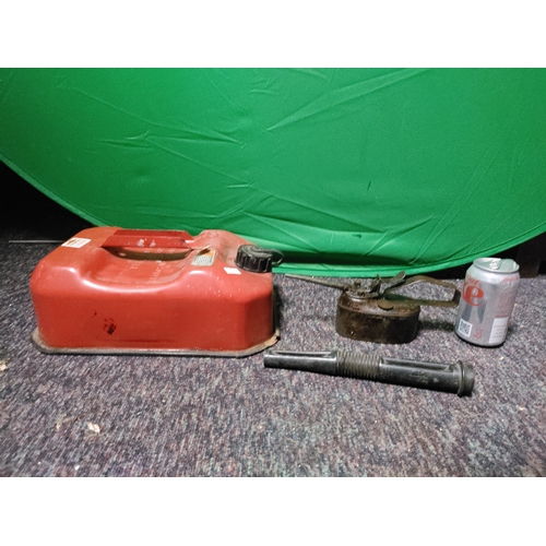 75 - A vintage red metal 5 litre jerrycan, a vintage metal oil can.