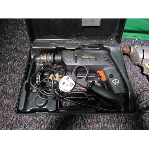 76 - A collection of 3 drills. To include Black & Decker corded electric drill, Black & Decker BD155RT ha... 