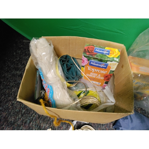80 - A collection of garden items. To include false stones, string, plant food, bird feeder, pruners, was... 