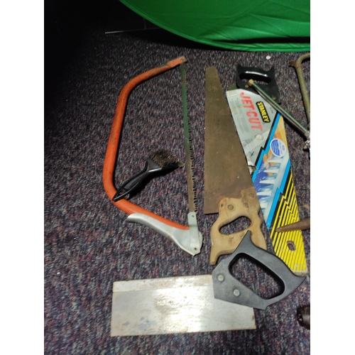 82 - A collection of tools. To include saws, hammers, etc...