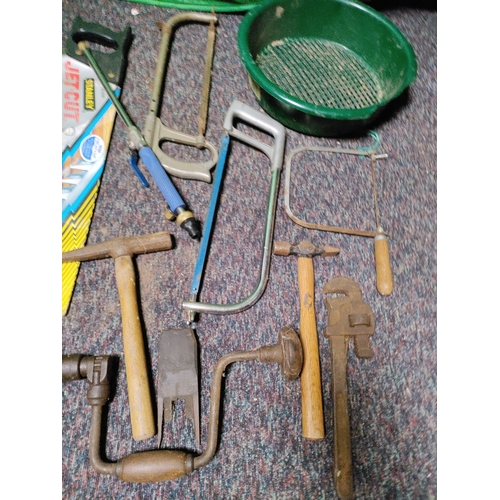 82 - A collection of tools. To include saws, hammers, etc...