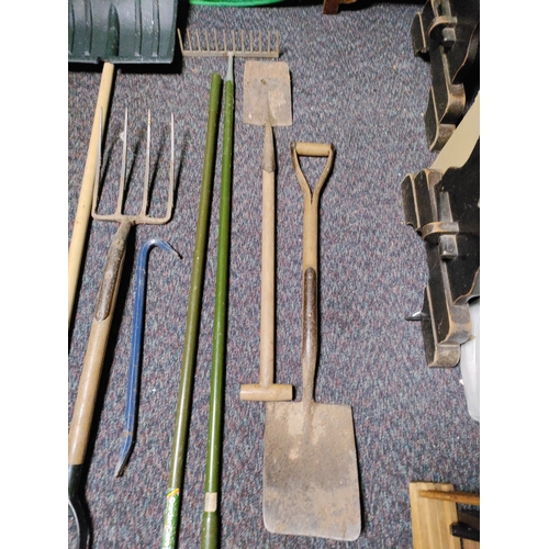 88 - A collection of 8 garden tools. To include snow shovel,  2 shovels, pitchfork, crow bar, Dutch hoe, ... 