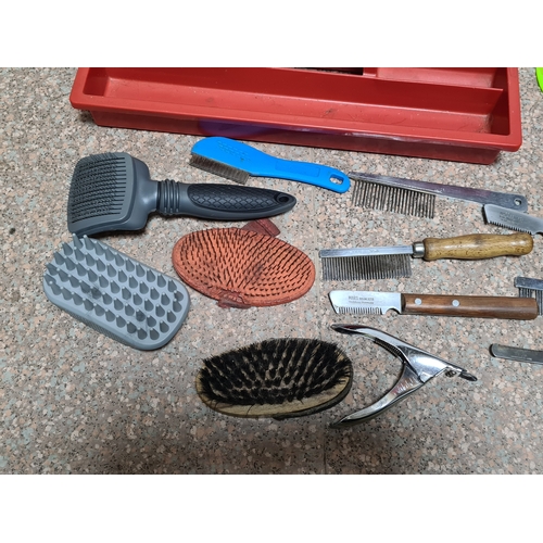 93 - A collection of vintage Dog / pet grooming tools to include, combs, hair brushes, scissors and pen k... 