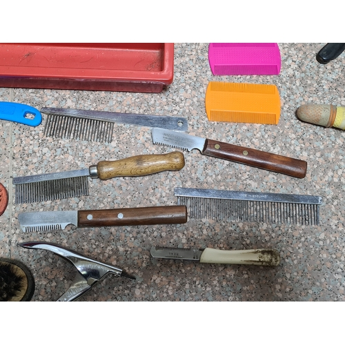 93 - A collection of vintage Dog / pet grooming tools to include, combs, hair brushes, scissors and pen k... 