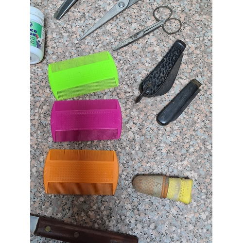 93 - A collection of vintage Dog / pet grooming tools to include, combs, hair brushes, scissors and pen k... 