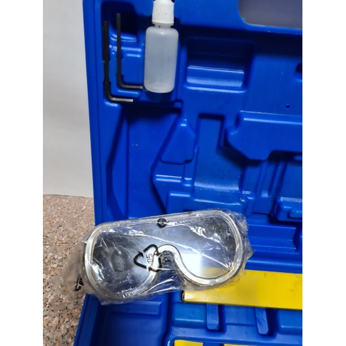 94 - A Draper Combination Nailer /Stapler Air Tool Kit in a plastic box with additional staples and heavy... 