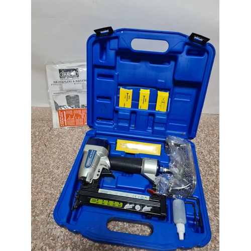 94 - A Draper Combination Nailer /Stapler Air Tool Kit in a plastic box with additional staples and heavy... 