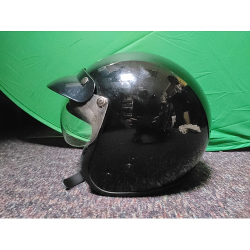 104 - A black half-face motorcycle helmet.(Size XL)