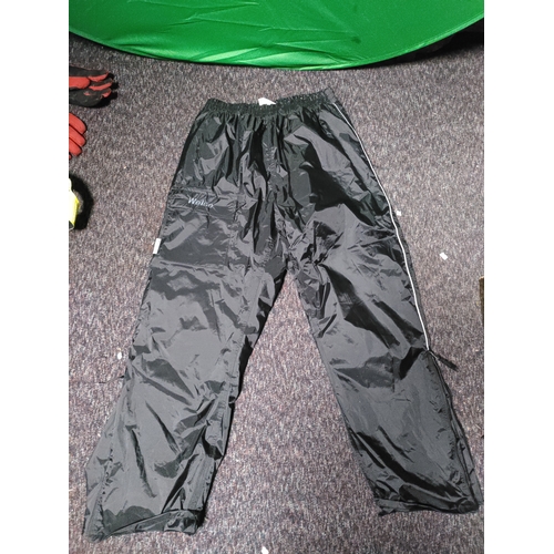 109 - A collection of protective clothing. To include 2 pairs of weise motorcyclist trousers one size XXL,... 