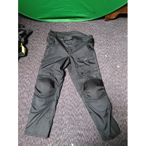 109 - A collection of protective clothing. To include 2 pairs of weise motorcyclist trousers one size XXL,... 