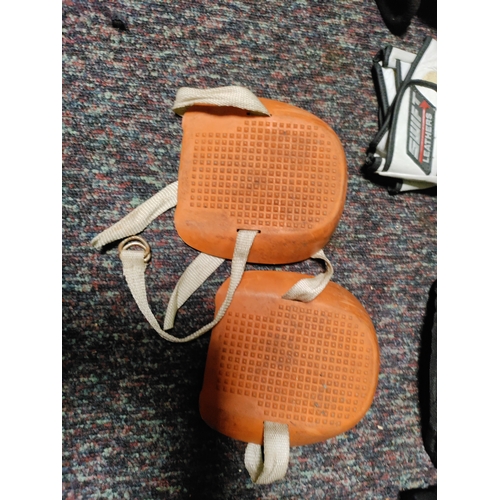 116 - A collection of protective equipment. To include black spur knee pads, Stihl safety helmet, rolson k... 
