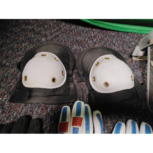 116 - A collection of protective equipment. To include black spur knee pads, Stihl safety helmet, rolson k... 