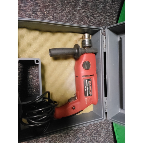 119 - A champion corded impact drill.