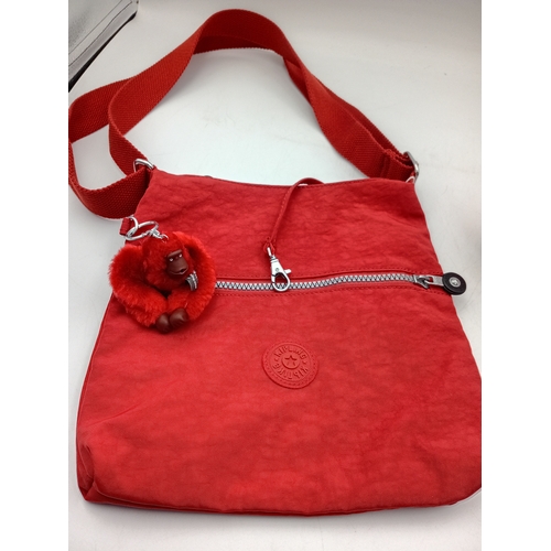 279 - A burnt orange Kipling crossbody handbag