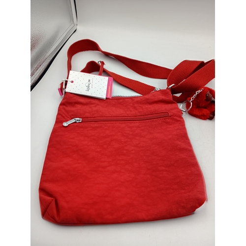 279 - A burnt orange Kipling crossbody handbag