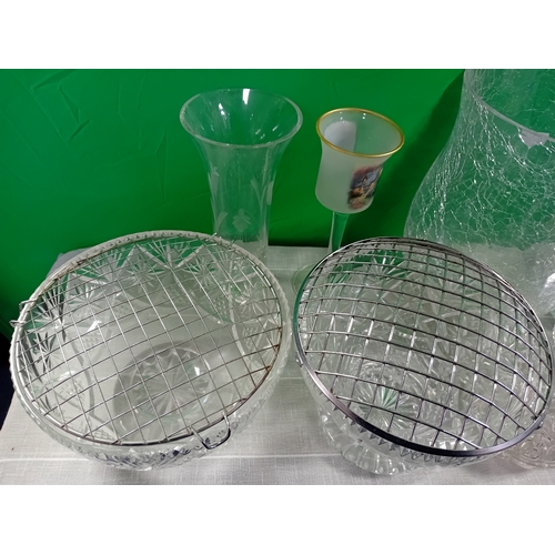 14 - A collection of glassware including vases, candle holders and drink ware. Some damage as shown in ph... 