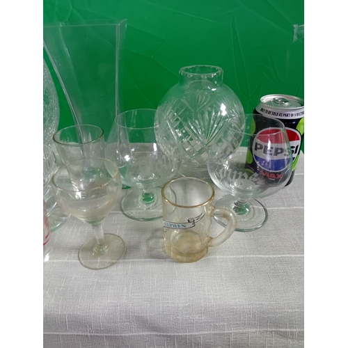 14 - A collection of glassware including vases, candle holders and drink ware. Some damage as shown in ph... 