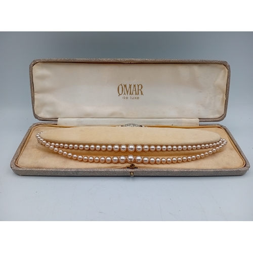 356 - A vintage omar de luxe Pearl necklace.
