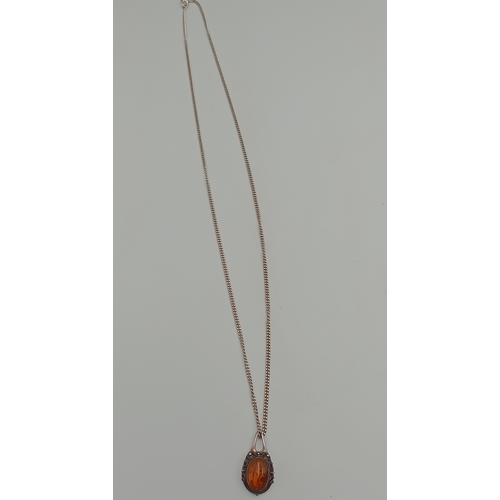 357 - A stamped 925 silver amber pendant on a stamped 925 silver necklace.