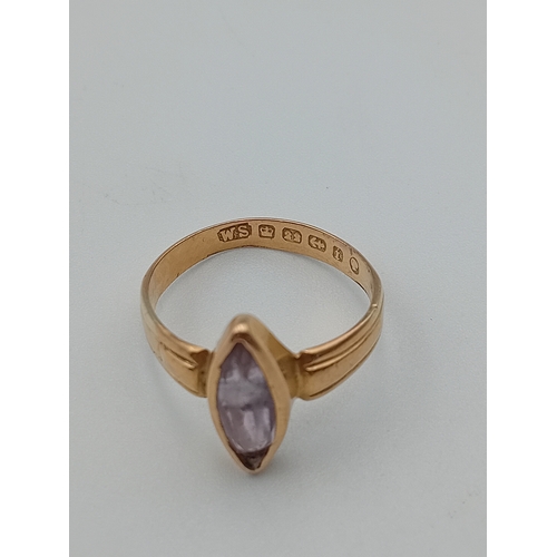 399 - An antique hallmarked Birmingham 22ct gold ring set with a lilac colour stone. Size O