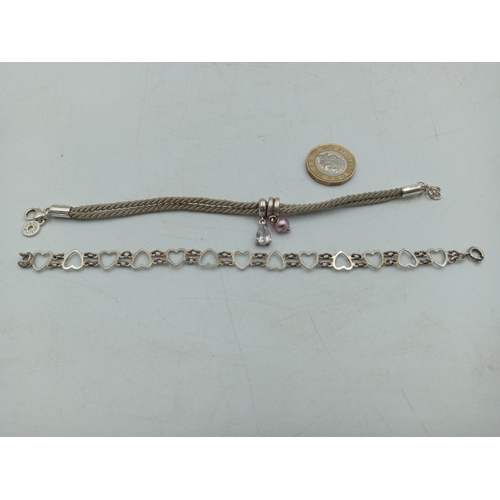 366 - A pair of bracelets, one 