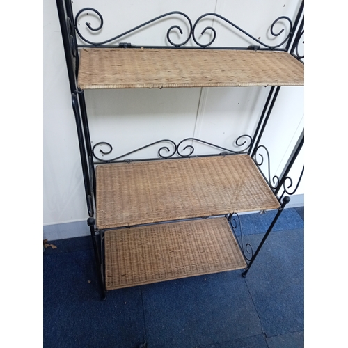 58 - A Collapsible Wrought Iron and wicker shelving unit. Measures H 168cm x W 70cm x D 27cm. When collap... 