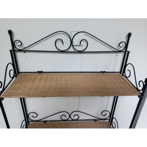 58 - A Collapsible Wrought Iron and wicker shelving unit. Measures H 168cm x W 70cm x D 27cm. When collap... 