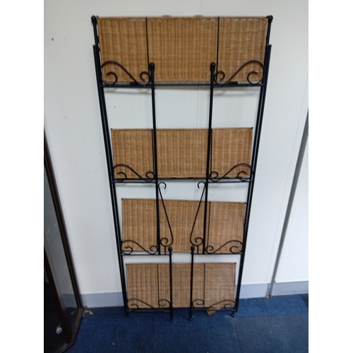 58 - A Collapsible Wrought Iron and wicker shelving unit. Measures H 168cm x W 70cm x D 27cm. When collap... 