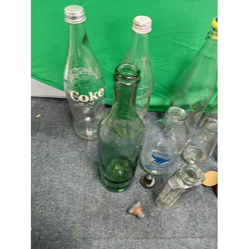 63 - A collection of vintage and antique bottles, to include, a Coke bottle, Bennetts Farms bottle, Birmi... 