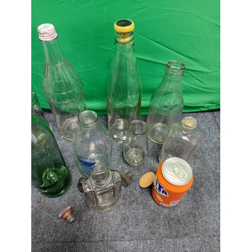 63 - A collection of vintage and antique bottles, to include, a Coke bottle, Bennetts Farms bottle, Birmi... 