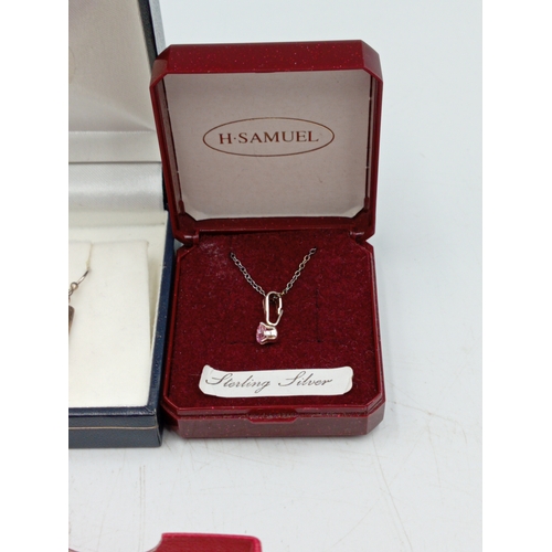377 - Two pairs of silver earrings and a silver necklace with a pink stone. one yellow metal and one white... 