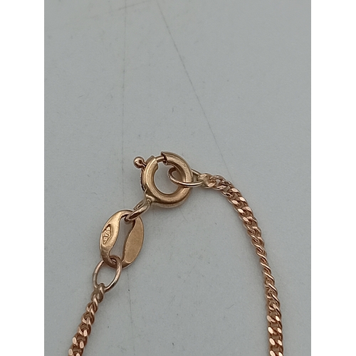 385 - A stamped 375 9ct gold pendant necklace set with a sapphire and diamonds. Length 17.5 inches.