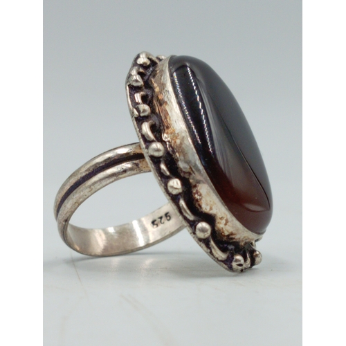 381 - A vintage stamped 925 silver ring set with a large Amber coloured stone. Size O