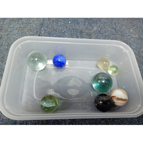 155 - A collection of vintage marbles in various colours and sizes.