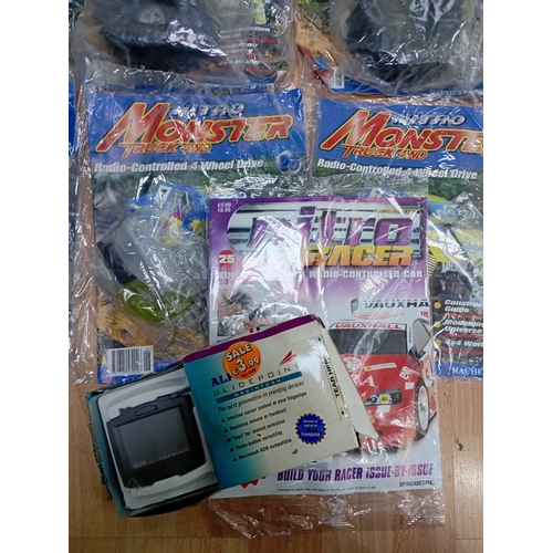 160 - A collection of vintage DIY Nitro Monster Truck 4WD RC sealed magazines including Nitro Racer & a AL... 