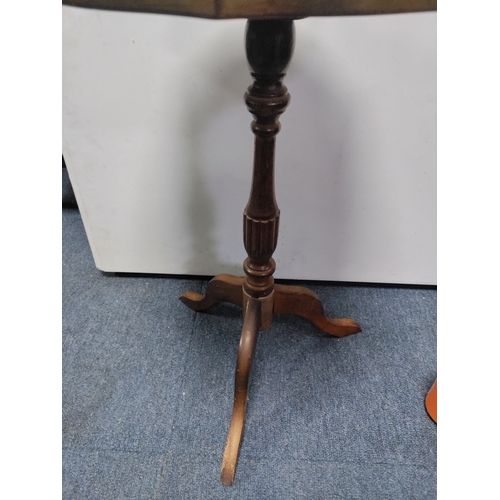 133 - A vintage wood side table with a pie-crust edge and red leather top with gold leaf pattern inlay.
