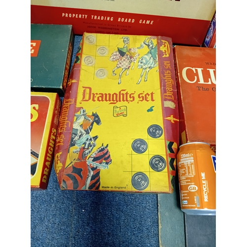 163 - A collection of vintage board games, to include, Monopoly, Scrabble, Draughts and Cludeo.